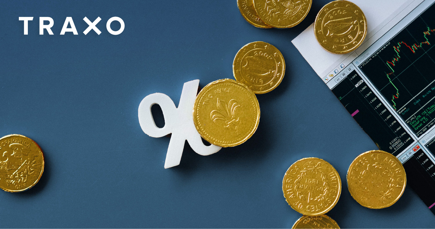 Coins on Blue Background | Traxo Currency Conversion Product Update Blog