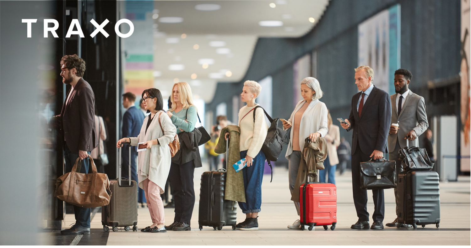 Corporate Travel Trends 2025 - People In Line at Airport